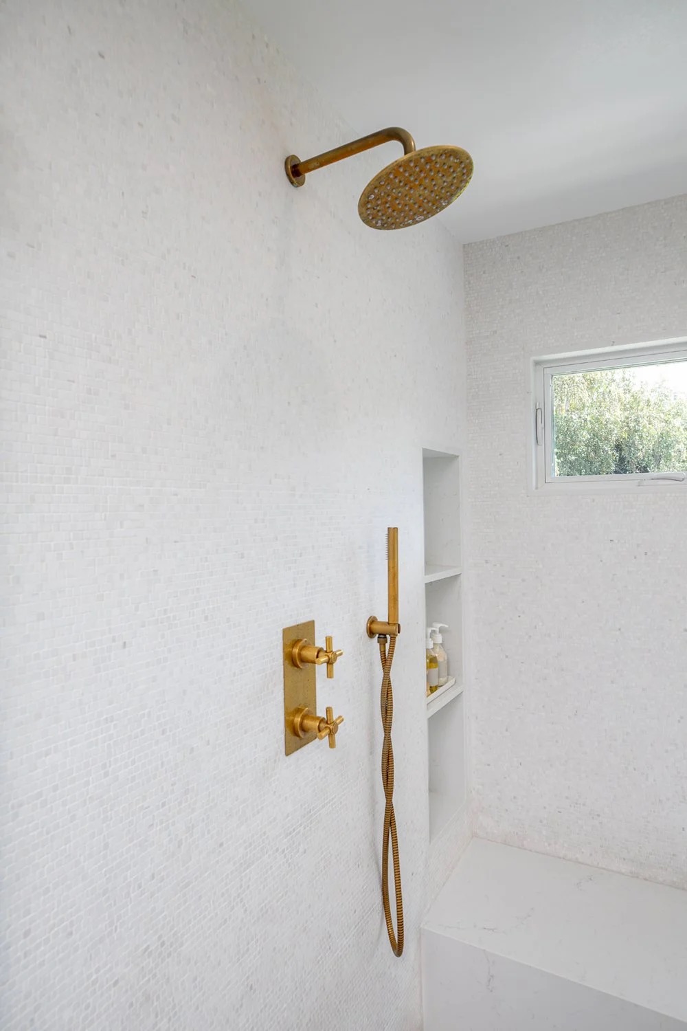 Saddle House, primary bathroom shower in the project by KADI Design