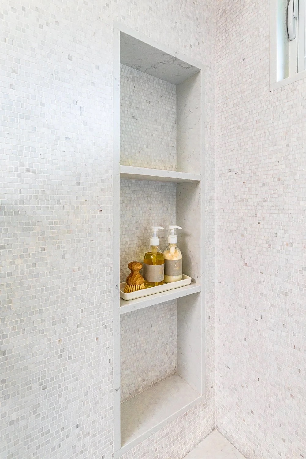 Saddle House, primary shower shelving in the project by KADI Design